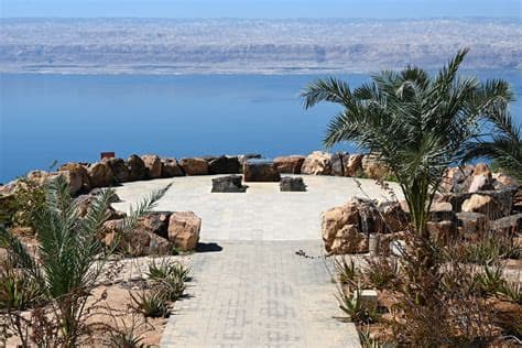 The stone viewpoint plaza among palms above the Dead Sea