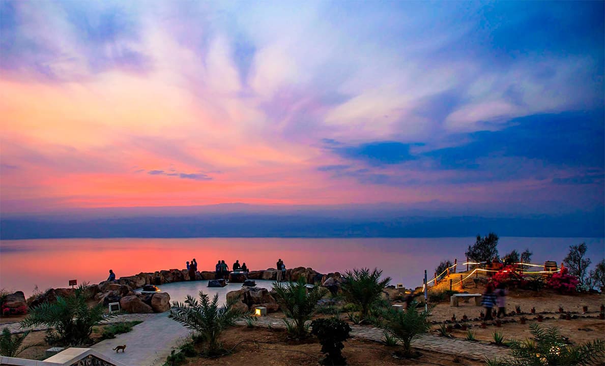 Sunset over the Dead Sea from the Panorama terrace, guests gathered at the viewpoint